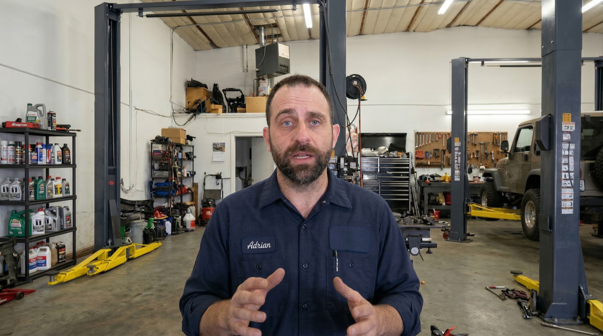 Adrian, founder of Car Care Garage, standing in his shop